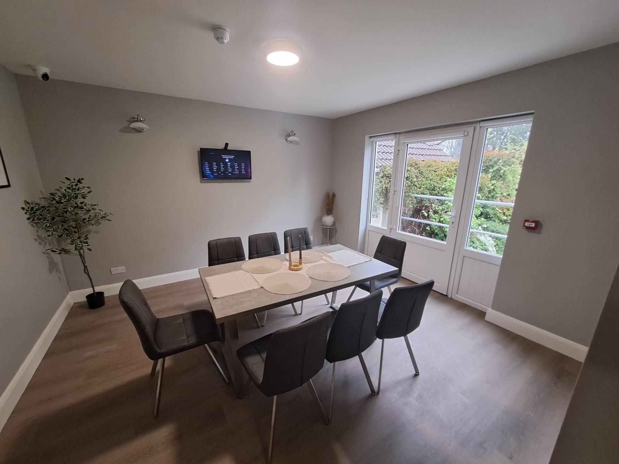 Dining area with doors opening to the garden