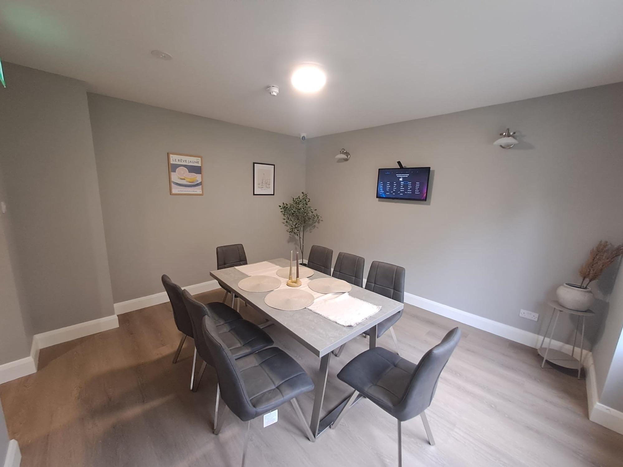 Dining room with seating for six around a shared table