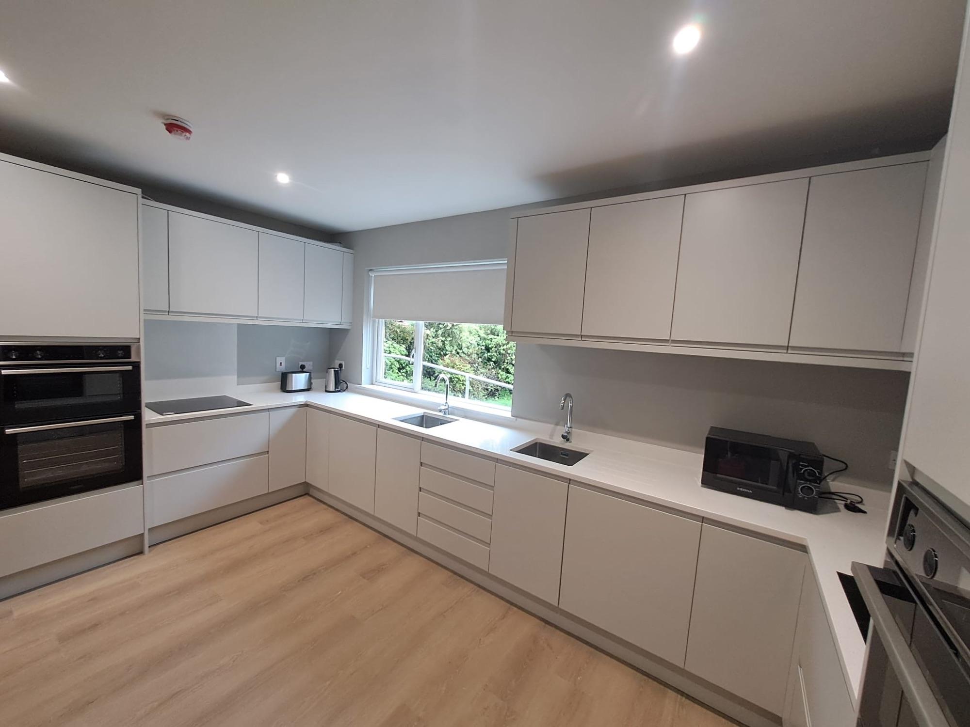 Shared kitchen with a window over the sink
